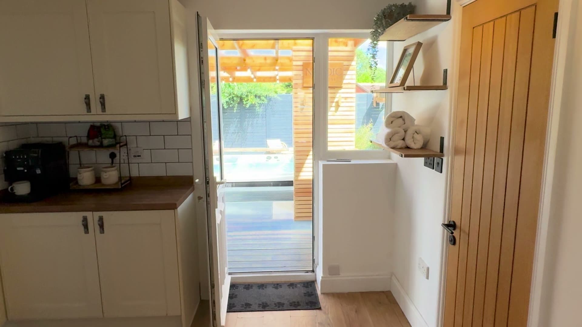 Looking out from the kitchen, through the house to the garden spa